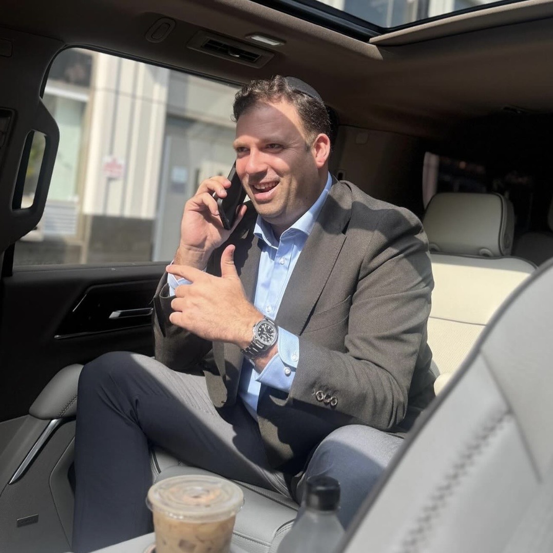 Client wearing a tailored gray jacket