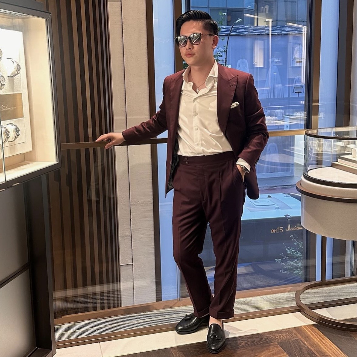 Client wearing a custom burgundy suit